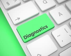 "Diagnostics" button on the Metallic Keyboard lying on Green Background. 3D.